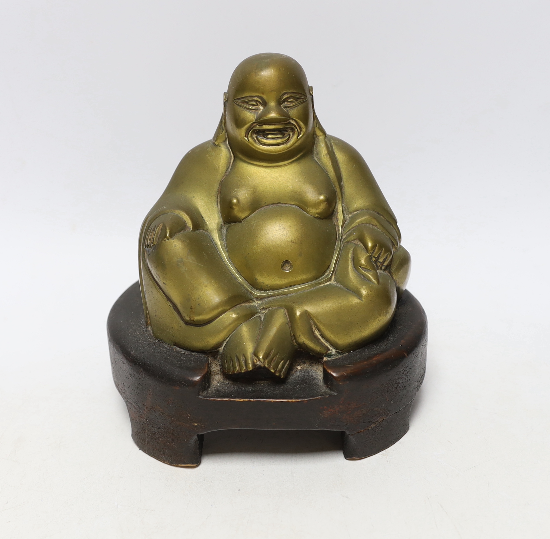 A bronze model of a seated Budai on hardwood base, 20cm